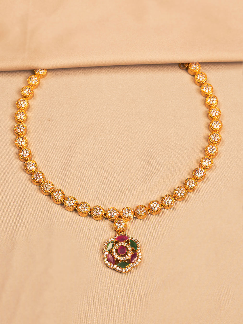 Elegant Gold-Plated Floral Necklace with Crystal and Ruby-Green Accents