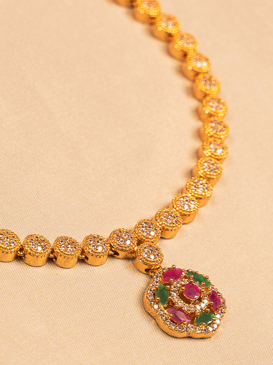 Elegant Gold-Plated Floral Necklace with Crystal and Ruby-Green Accents