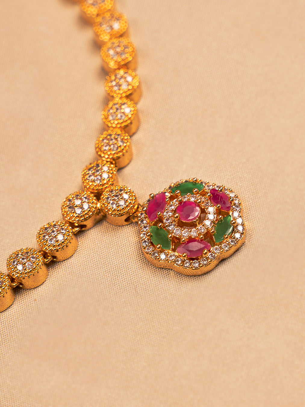 Elegant Gold-Plated Floral Necklace with Crystal and Ruby-Green Accents