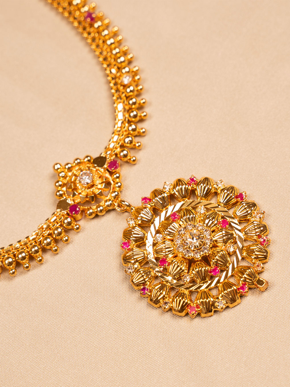 Regal Floral Antique Gold Temple Necklace with Ruby Accents