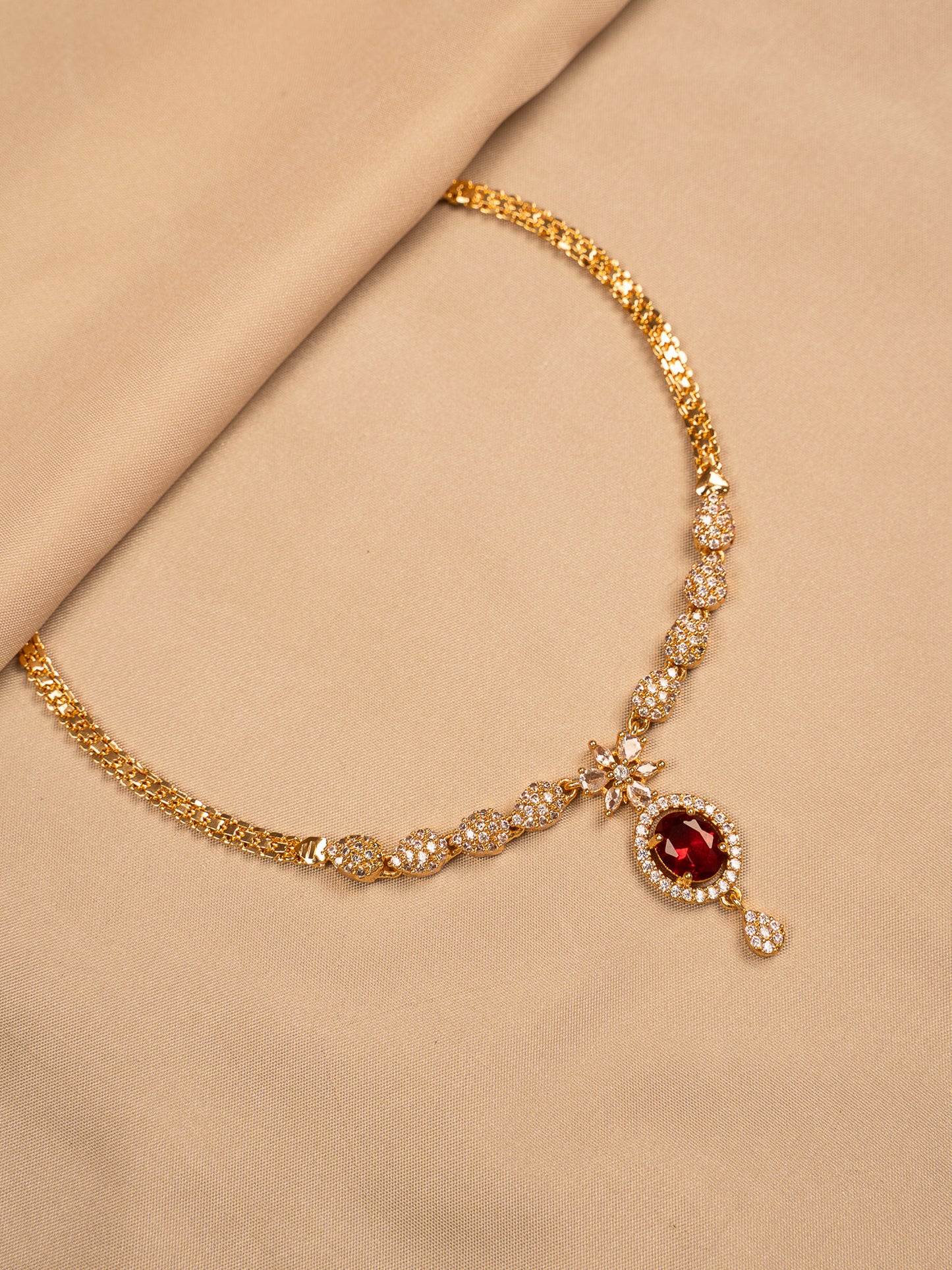 Elegant Gold Necklace with Red Stone Pendant & White CZ Detailing