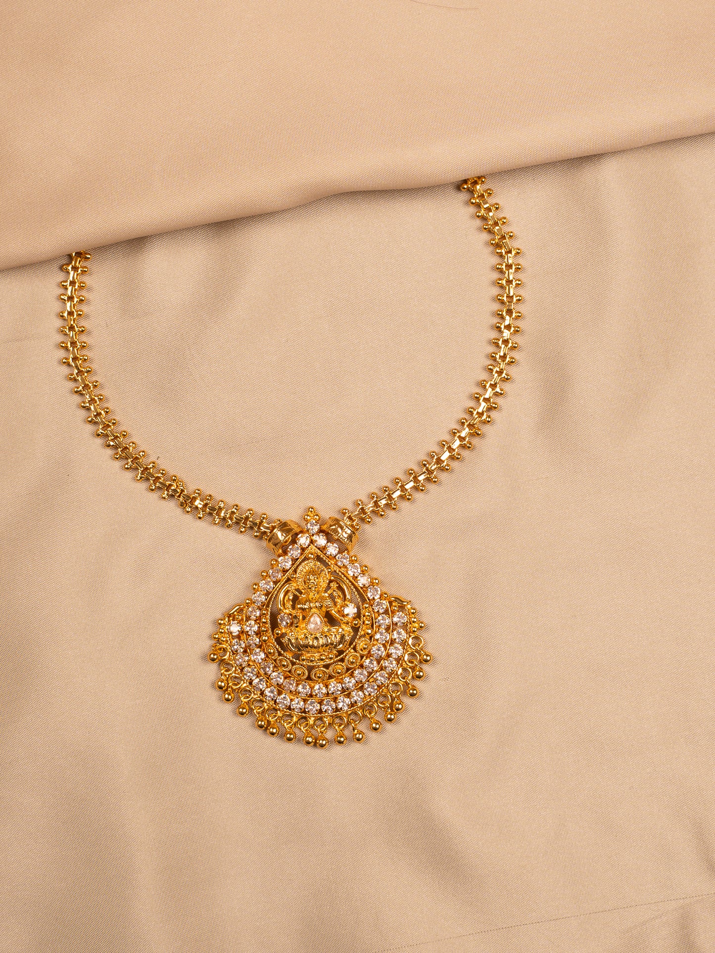 Lakshmi Teardrop Pendant with Stone Embellishments – Temple Style Gold Finish