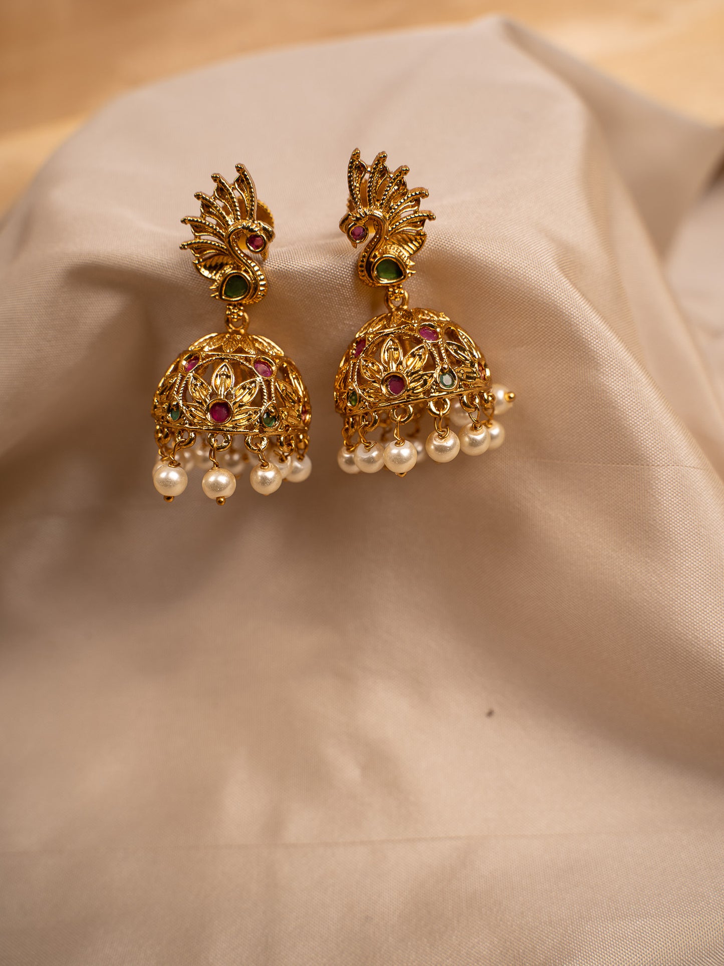 Peacock-Inspired Gold Jhumka Earrings with Pearl Drops