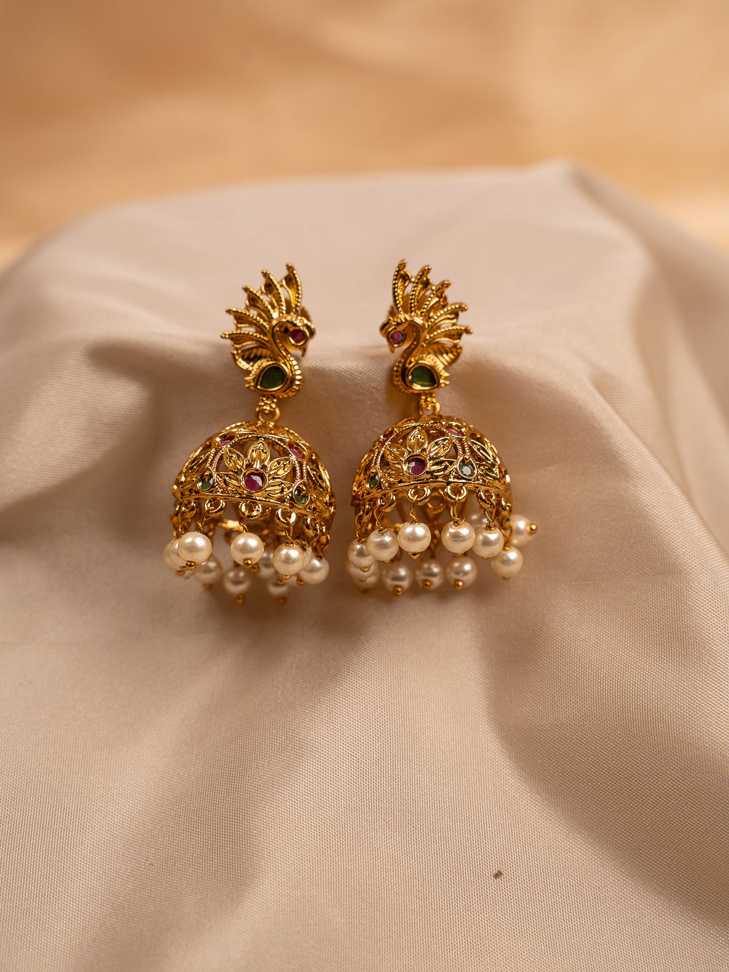 Peacock-Inspired Gold Jhumka Earrings with Pearl Drops